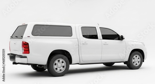 White pickup truck with a hardtop, side view, studio shot.