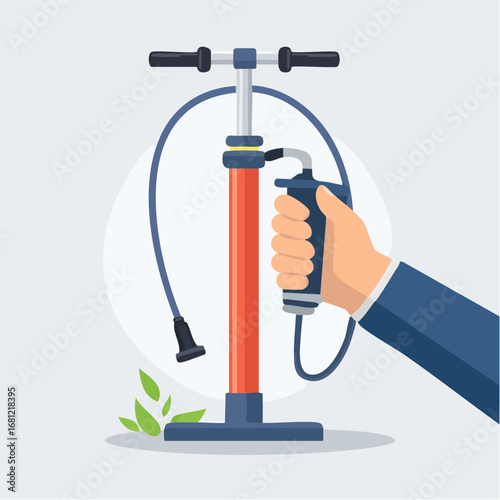 Hand Operating A Red Air Pump