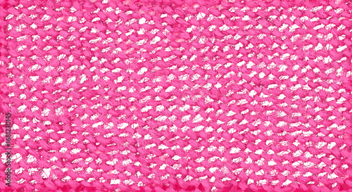Close up view of a knitted pink fabric with a repetitive pattern and texture