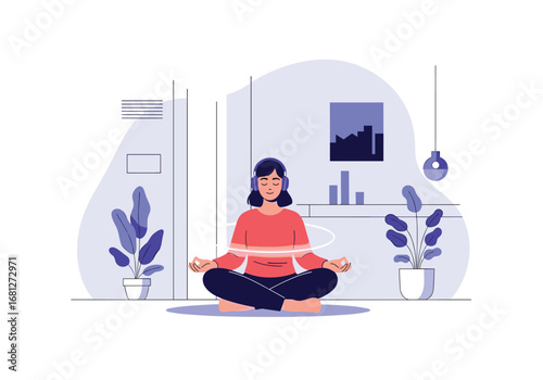 Calm woman meditating with headphones enjoying peaceful sounds in a serene indoor environment