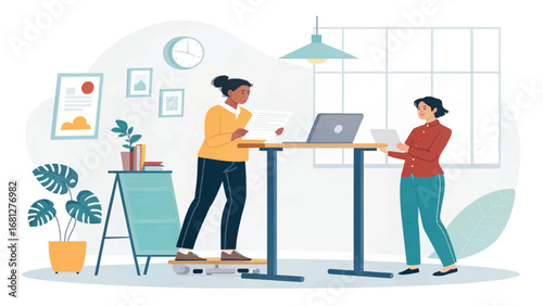Two colleagues collaborate in a modern office using a standing desk and active workstation, promoting productivity and healthy work habits.