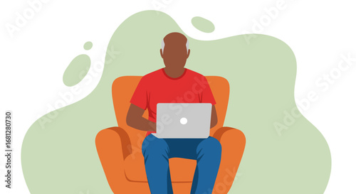 Senior Black man comfortably uses a laptop in an armchair, engaging with technology for business, learning, or leisure at home. Modern digital lifestyle.