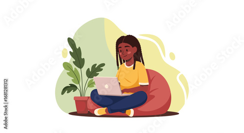 Smiling young Black woman comfortably uses a laptop on a beanbag chair. Ideal for concepts of remote work, online learning, home productivity, or digital lifestyle.
