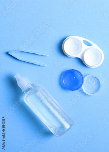 Wallpaper Mural Lenses for vision correction and accessories for lenses on a colored background,. Vertical photo format Torontodigital.ca