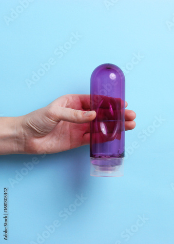 An intimate lubricant for comfortable sex close-up on a colored background.. Vertical photo format