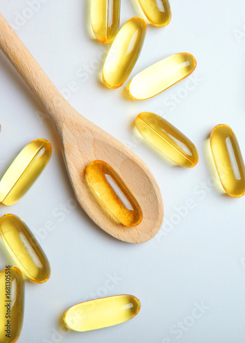 Omega 3 capsules on a white background with place for text. . Vertical photo format