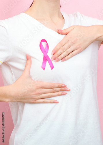 Pink ribbon, the international symbol of breast cancer.. Vertical photo format