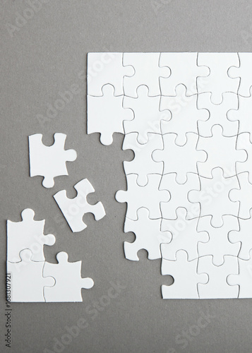 White puzzle on a colored background top view.. Vertical photo format