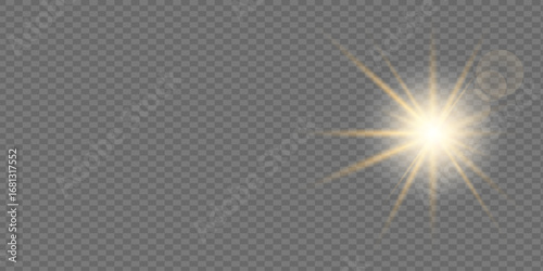 Realistic golden light flare with a bright starburst effect and sparkling rays, isolated on a transparent alpha channel background for easy overlay