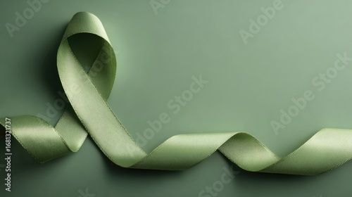 Textured ribbon on a green background creating flowing shapes.