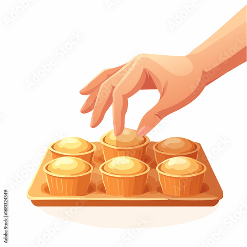Hand Picking Up a Golden Brown Muffin from a Tray of Freshly Baked Cupcakes