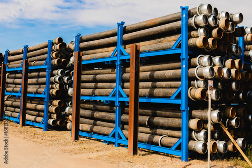 Foto Industrial construction Pipes Stacked on Storage Rack