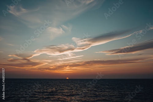 Sunset Over the Sea with Th...