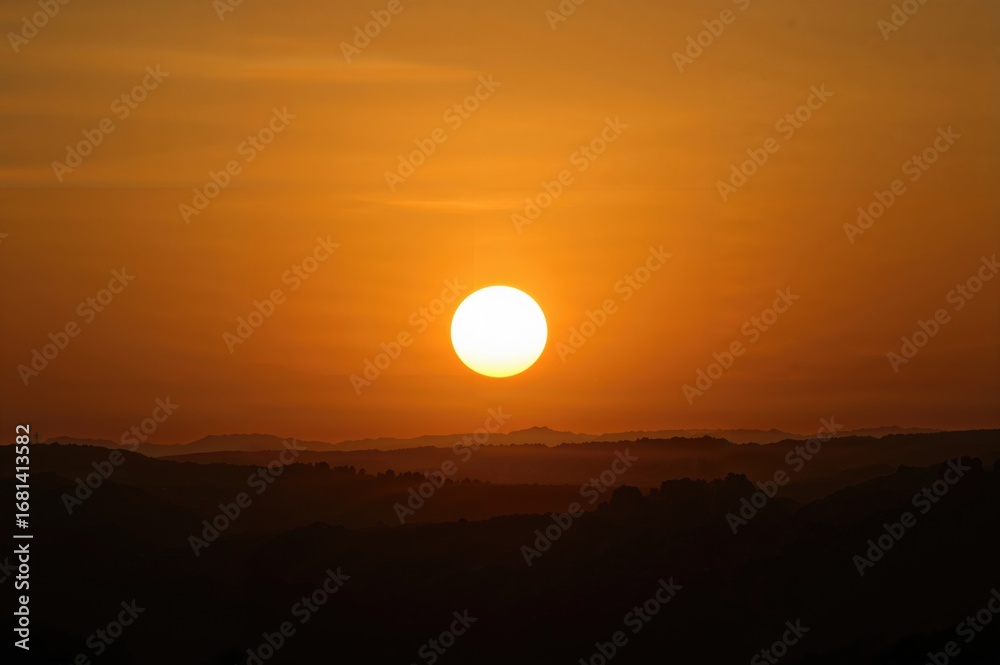 Fototapeta premium When the sun is close to the horizon, sunlight travels through more atmosphere, decreasing the strength of direct light.