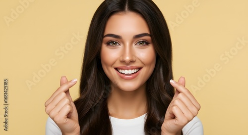 Beautiful Woman Smiling and Making a Heart Sign with Her Fingers, Love and Affection Concept