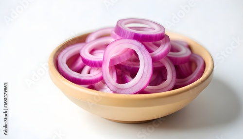 Sliced red onion in a rustic wooden bowl, studio shot on a seamless white background, soft natural lighting, shallow depth of field.
