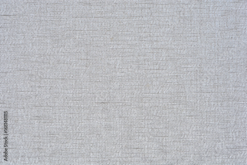 A horizontal macro shot of a light gray burlap fabric with a subtle horizontal weave, serving as a simple texture background