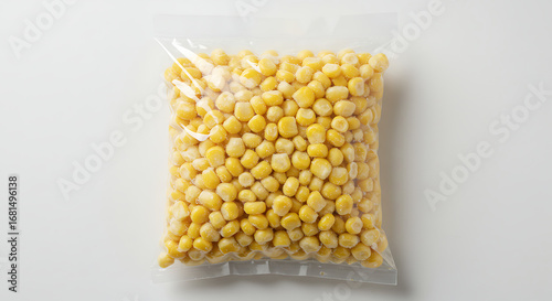 A Clear Package of Frozen Sweet Corn Kernels Set Against a Plain White Background Surface, Ideal for Food Industry Marketing