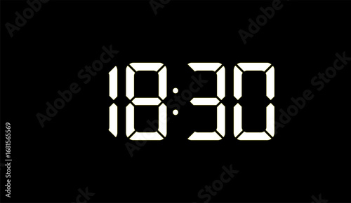 The image displays a digital clock showing the time as 10:30, with white blocky numbers illuminated against a stark black background in a clear, minimalist design
