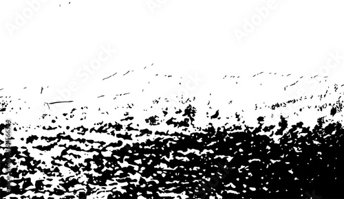 Abstract black and white grunge texture background features splattered ink shapes, creating a high-contrast and visually striking design ideal for adding depth and character