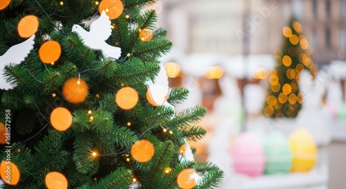 3d icon of closeup of a decorated christmas tree with orange lights and white doves