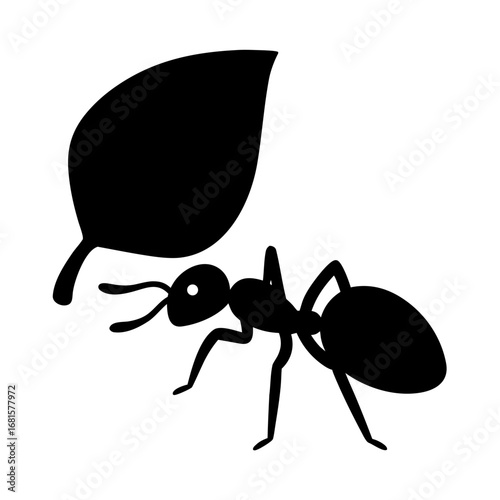 Ant carrying a large leaf in silhouette