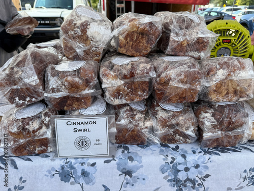 Enjoying Fresh Baked Goods at Holland Michigan Farmers Market With Cinnamon Swirl Treats