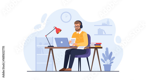 Focused man in headphones working on laptop at his home office desk. Ideal for remote work, online learning, or freelance business concepts.
