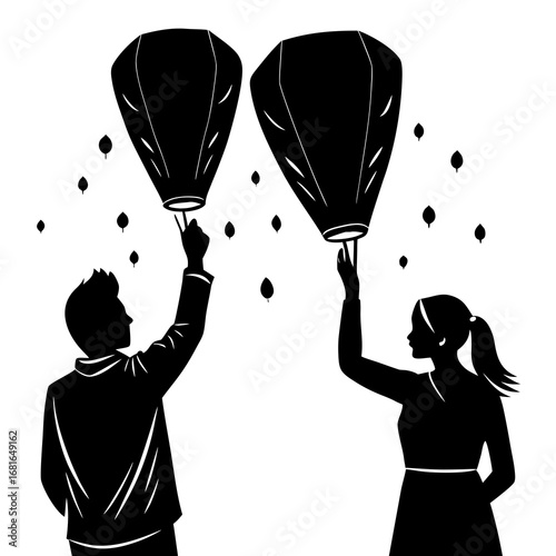 Silhouettes of couple releasing sky lanterns people
