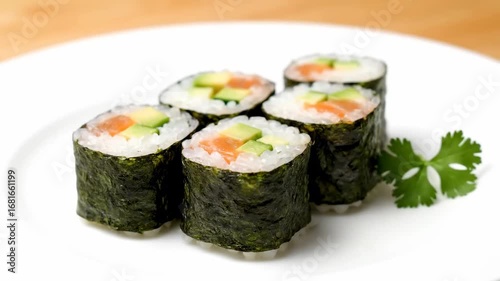 Wallpaper Mural Delicious Salmon Avocado Cucumber Sushi Rolls - Close-up shot of several hosomaki sushi rolls filled with salmon, avocado, and cucumber, arranged neatly on a white plate. Torontodigital.ca