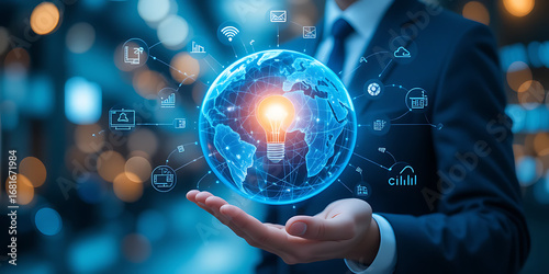 Businessman holding a glowing digital globe with icons representing technology and innovation in his hand