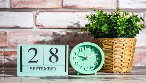 September 28 wooden block calendar with retro clock and woven basket