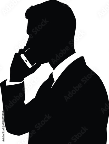 A businessman is talking phone in silhouette