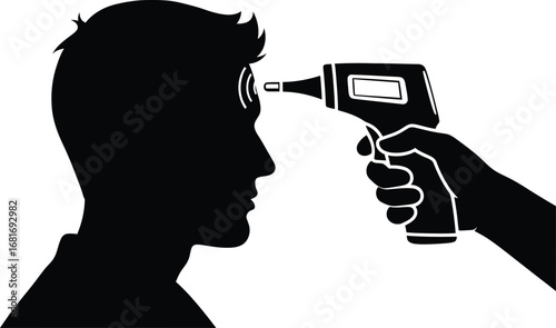 Silhouette of a person having their temperature checked with an infrared thermometer gun
