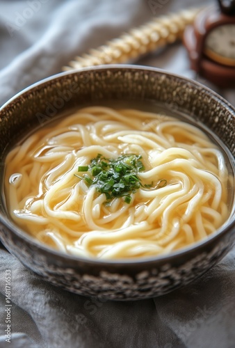 Creamy Pasta Served in a Rustic Bowl on a Textured Cloth in Natural Light.