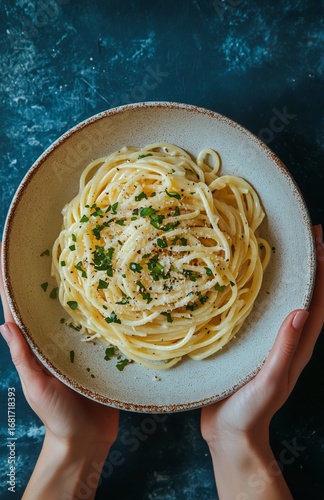 Delicious Spaghetti With Cheese and Herbs Served in a Rustic Bowl During Dinn...