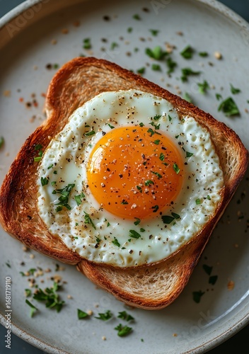 Perfect Sunny Side up Egg Served on Toasted Bread With Herbs