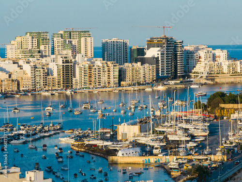 Sliema city, buildings, apartments and yachts, sea, coastline. Manoel island, Malta