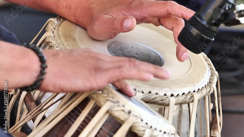 Musician playing tabla drums during a concert in India