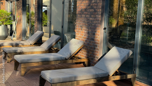 Canvas Print Sunlit, empty loungers whisper languid tales of siesta, casting shadows for Sols