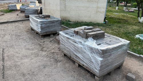 Принти на полотні Wrapped bricks sit immobile like silent sentinels, guarding dreams of future str