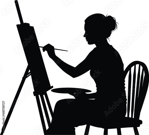 Artist painting silhouette woman at easel art studio creative
