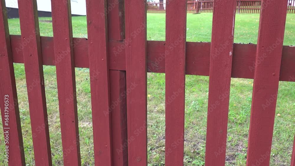 Stockholm, Sweden A Falu red-painted picket fence.