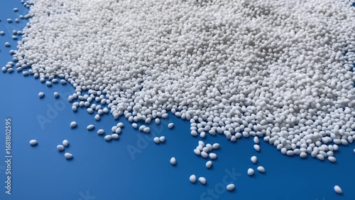 Close-up, background of many white thermoplastic granules. Design template. Concept: research, biochemistry, nature, pharmaceutical medicine.