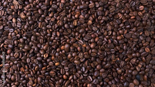 Top view of lots of roasted coffee beans. Background from natural products. Brown texture.