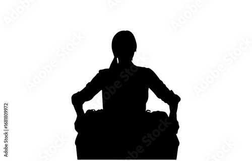 A black silhouette of a DJ deeply concentrated while mixing music on a turntable.