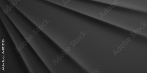 Dark gray fabric folds creating a smooth, abstract background with subtle shading and texture.