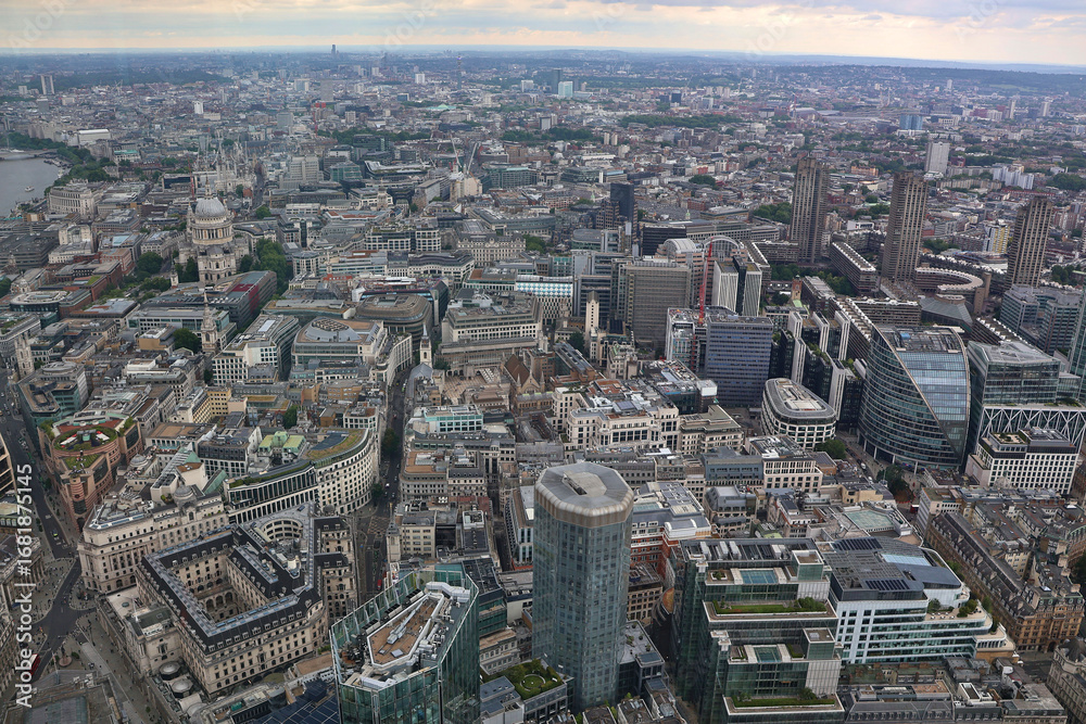 Fototapeta premium Aerial panoramic view looking west across the City of London skyline with modern skyscrapers, historic landmarks and urban architecture under daylight sky