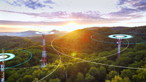 Φωτογραφία Communication towers emitting radio wave radiation at sunrise, symbolizing wirel