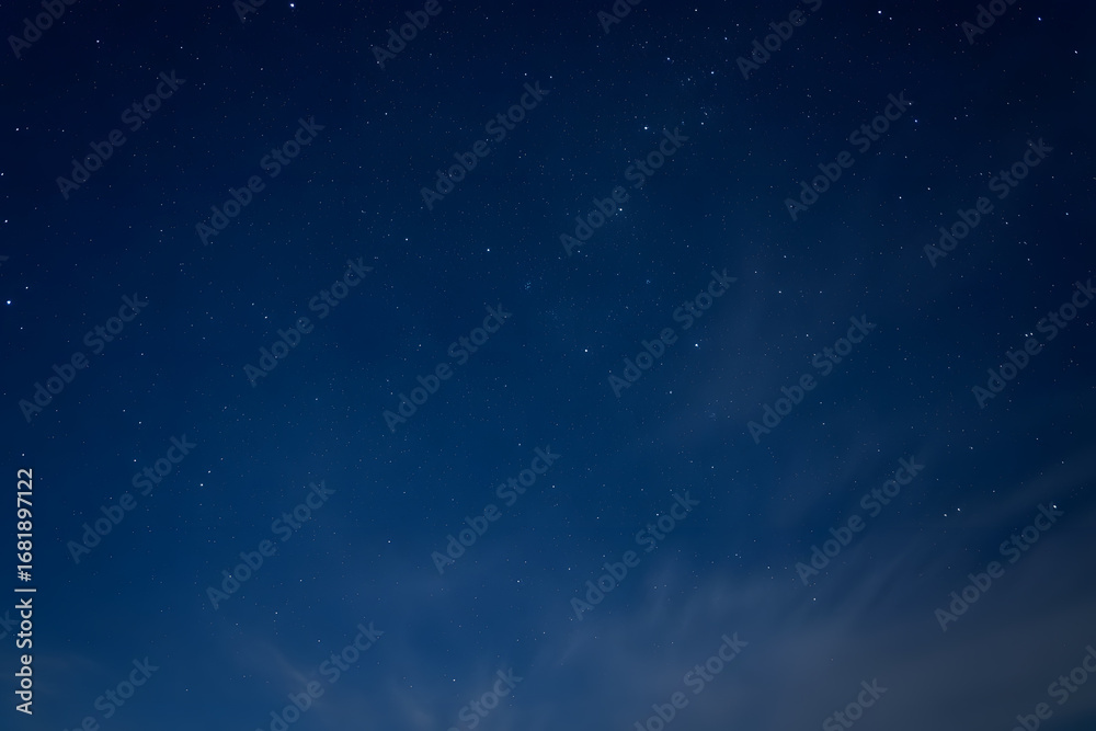 Obraz premium Beautiful night sky with stars and clouds, perfect for backgrounds, wallpapers, and dreamy designs